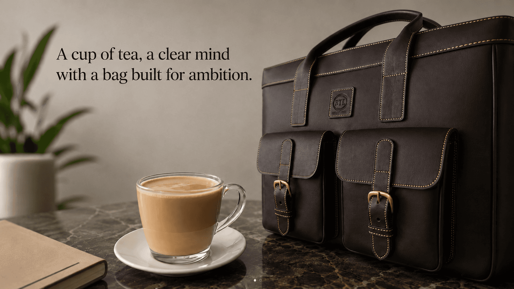 Leather work bag beside a cup of tea